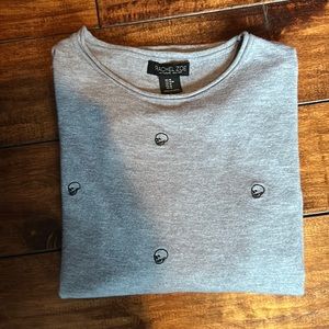 Super comfy Halloween sweater with adorable skulls.